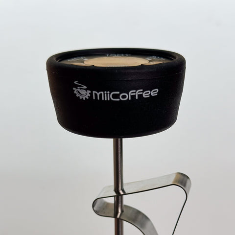 MiiCoffee thermometer in action on espresso milk steam for glossy microfoam.