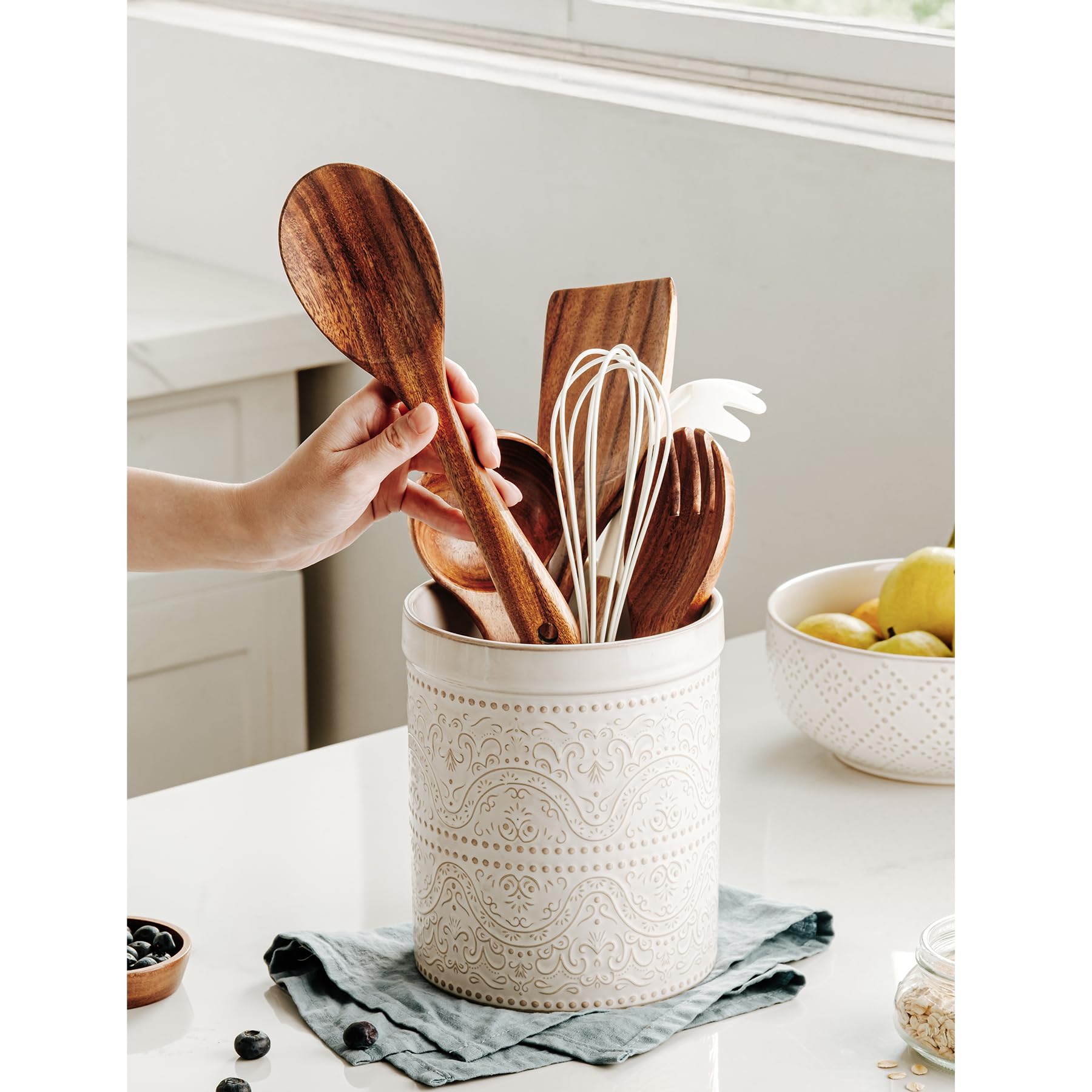 MIKIGEY off-white countertop utensil holder keeps spatulas and spoons within easy reach.