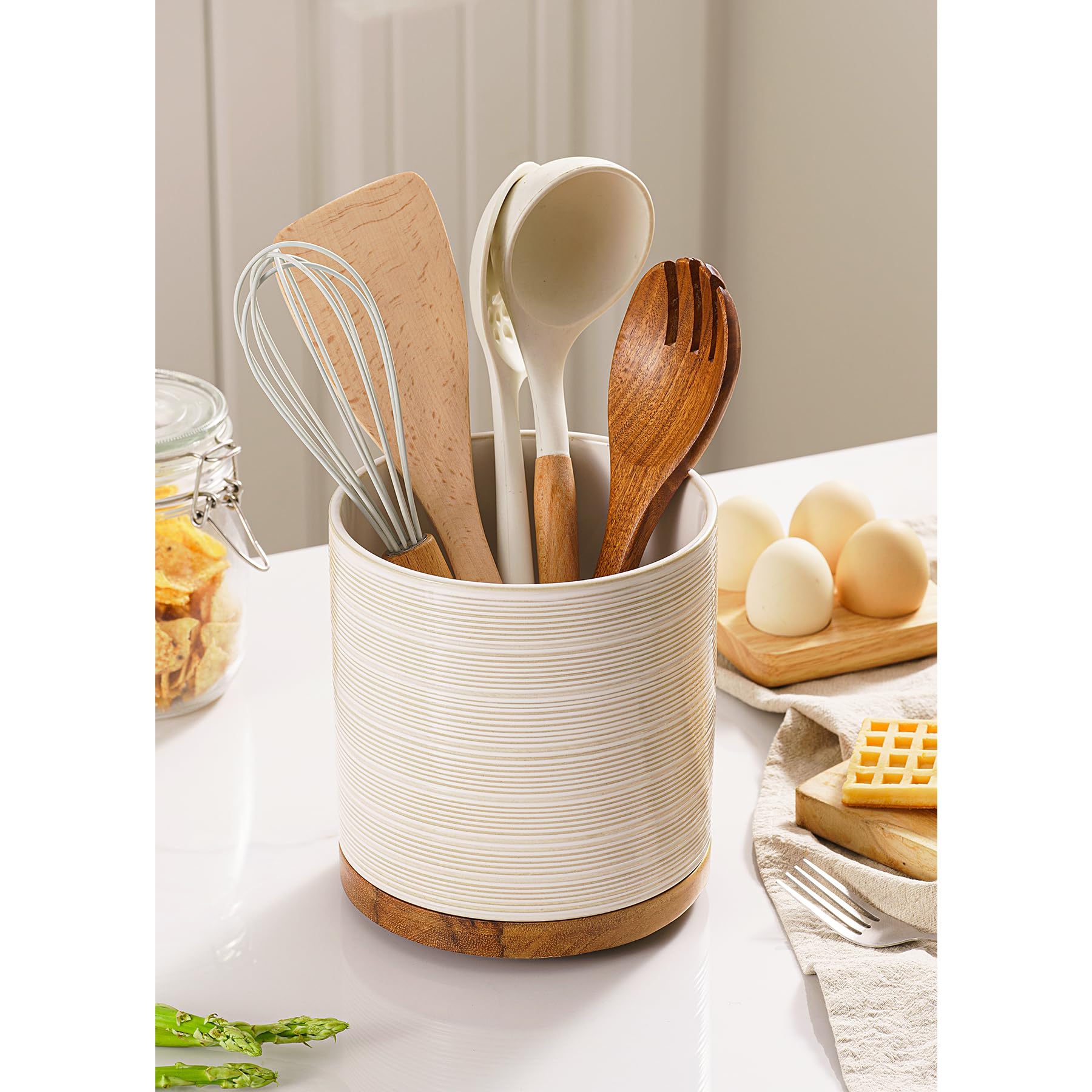 MIKIGEY ceramic crock keeps spatulas accessible and organized on the counter.