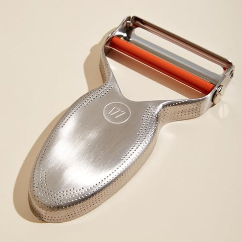 Milk Street Precision Peeler with replaceable blades for versatile peeling tasks.