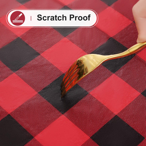Misaya close-up of wipe-clean tablecloth demonstrates easy maintenance with a damp cloth.