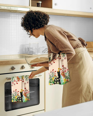Miss Adola kitchen decor towel adds spring charm to any counter.