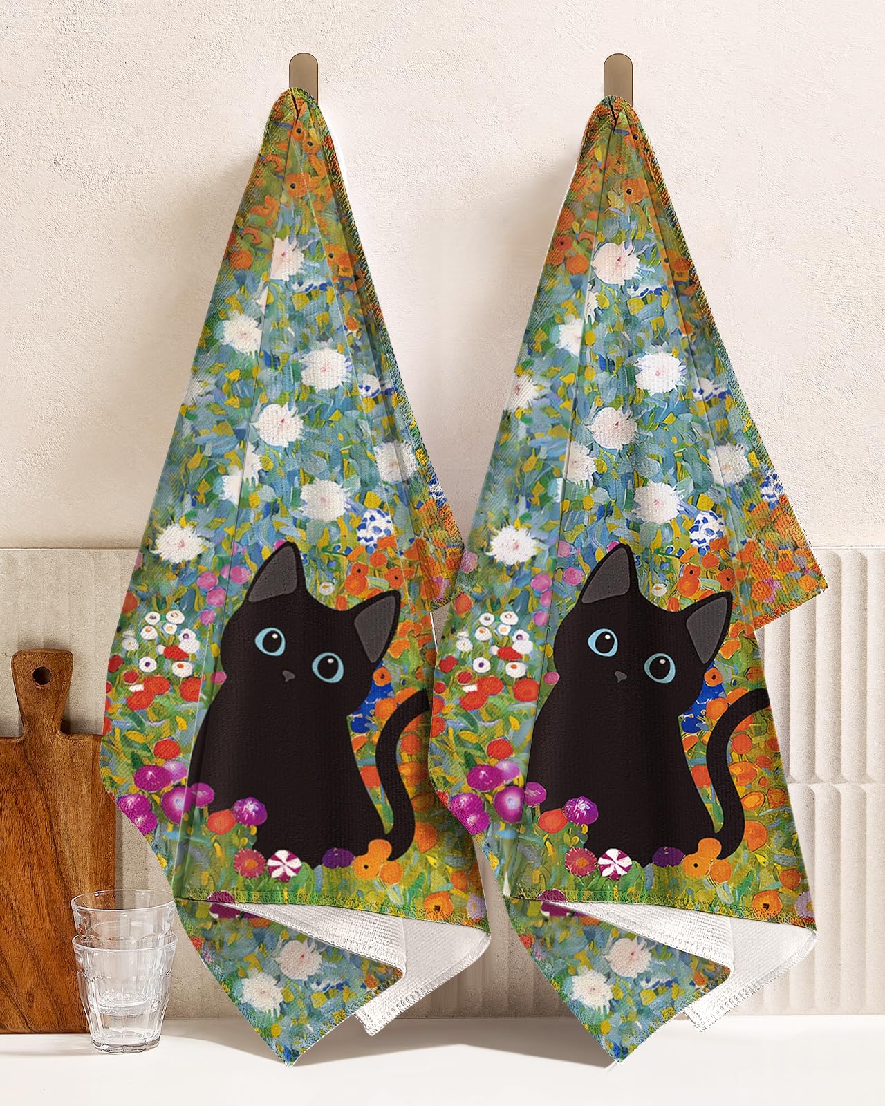 Miss Adola two-print towels balance decor with practical cleaning tasks.