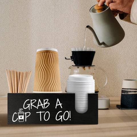 Mistod storage for cups, lids, and stirrers maintains a tidy beverage setup.