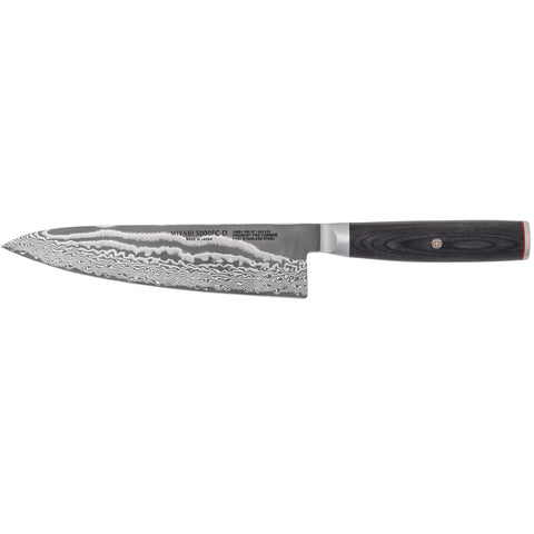 MIYABI Kaizen II in-use with vegetables for smooth slicing.