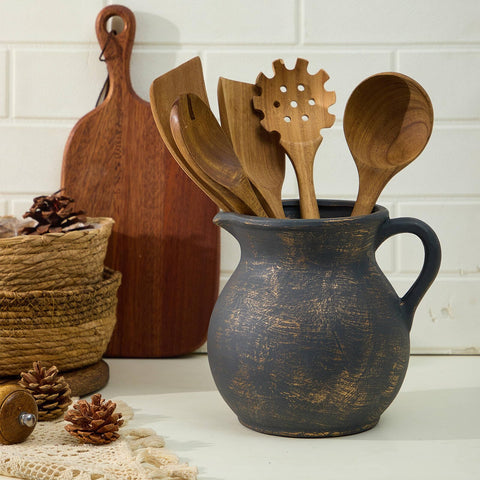 MIYUKI handmade ceramic utensil croc highlights natural warmth in a cozy kitchen display.