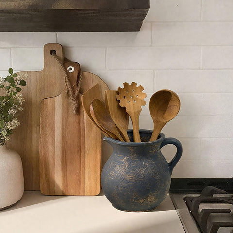 MIYUKI countertop crock neatly stores utensils for quick access during cooking tasks.