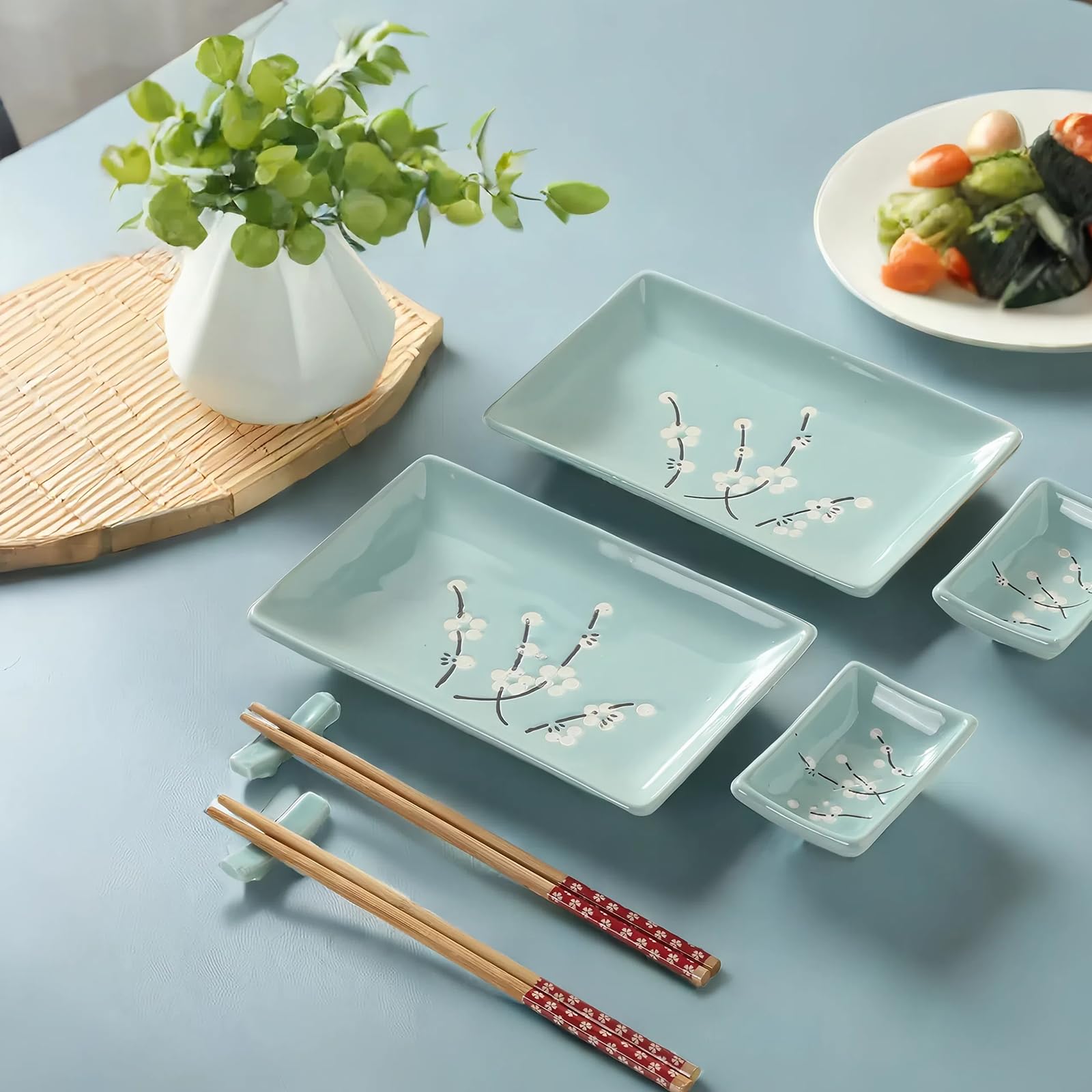 Mocerakai rectangular serving trays highlight the blue plum motif on the table