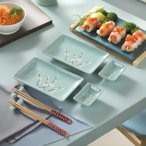 Mocerakai sushi plates with chopsticks and holders ready for serving guests