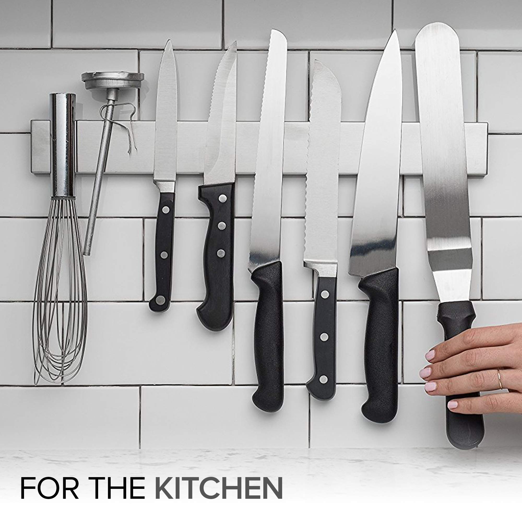 Modern Innovations magnetic knife bar securely holding large chef knives.