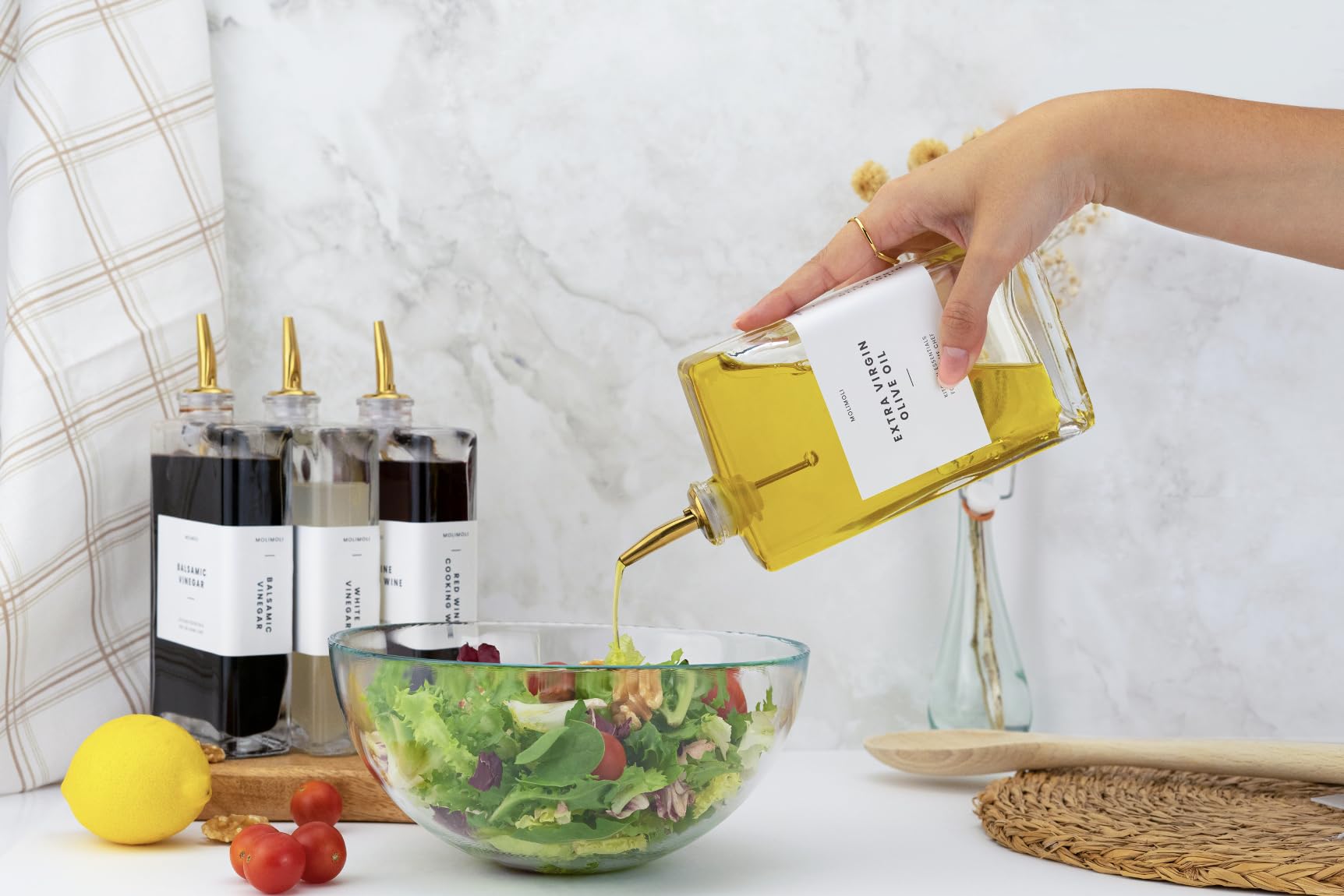Molimoli pouring action demonstrates controlled flow for neat dressing and sauces.