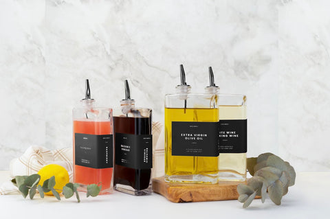 Versatile glass bottles suitable for oil, vinegar, syrup, and sauces.