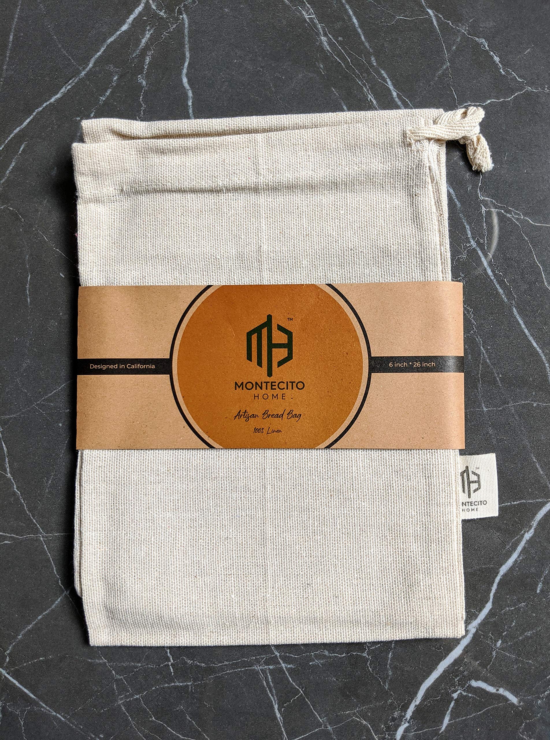 Montecito Home kitchen styling with natural and black bags on a counter.