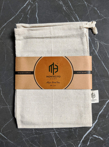 Montecito Home kitchen styling with natural and black bags on a counter.