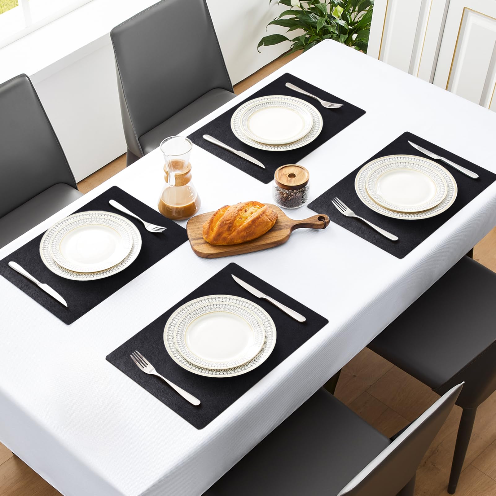 MOSAYT waterproof placemats keep surfaces clean during sauces and spills.