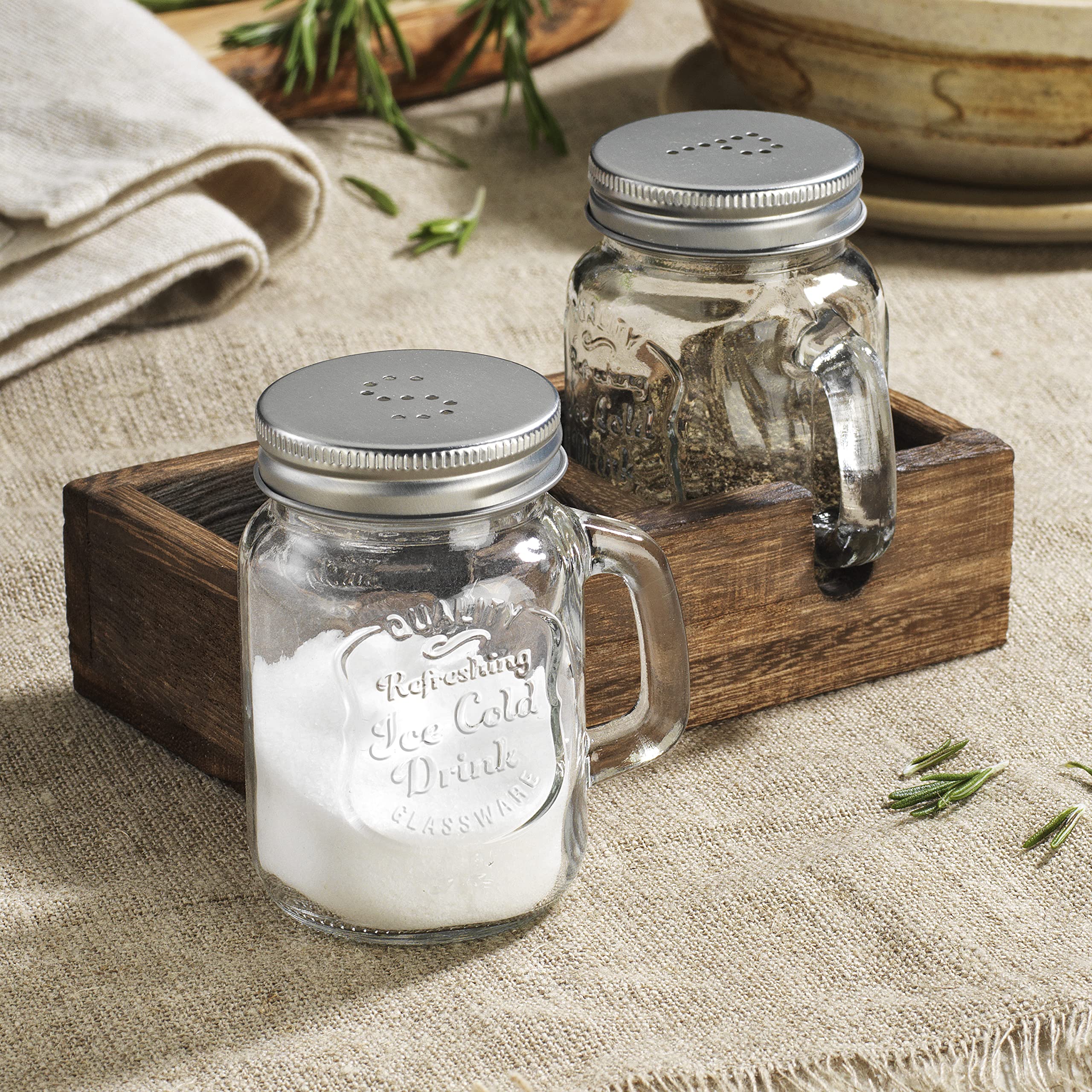 MosJos vintage glass condiment dispensers with stainless lids for precise seasoning.