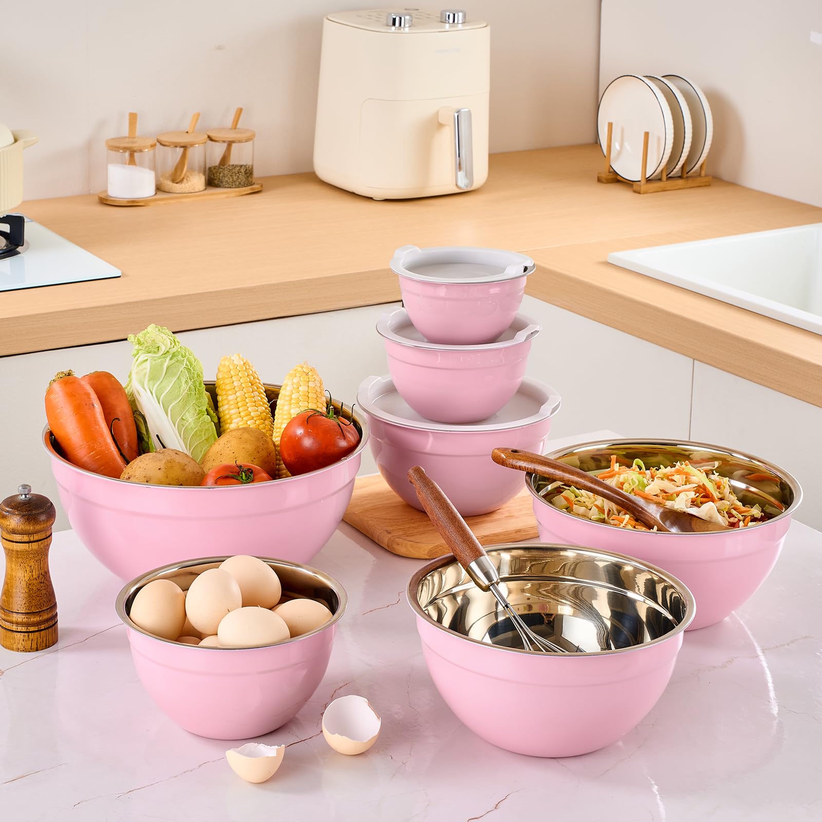 Moxinox pink mixing bowls set offers seven sizes for versatile cooking tasks.