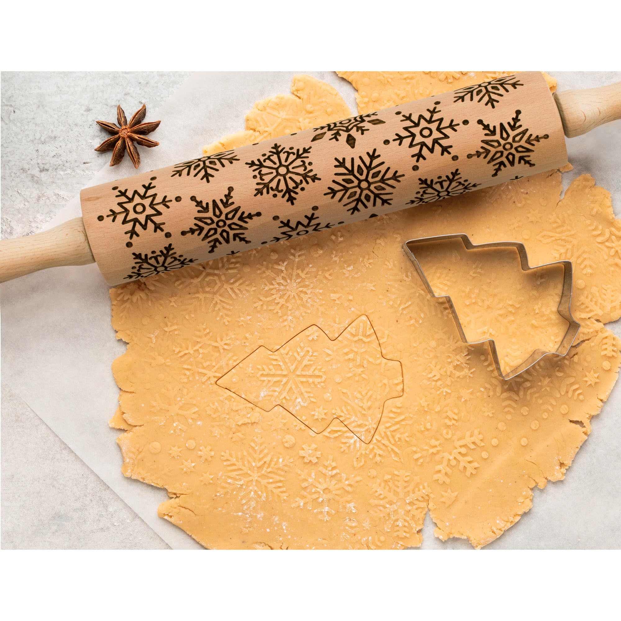 Rolling pin creates snowflake dough imprint for cookies and fondant