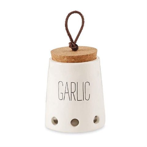 Mud Pie Garlic Keeper with cork top on kitchen counter keeps garlic fresh and handy.