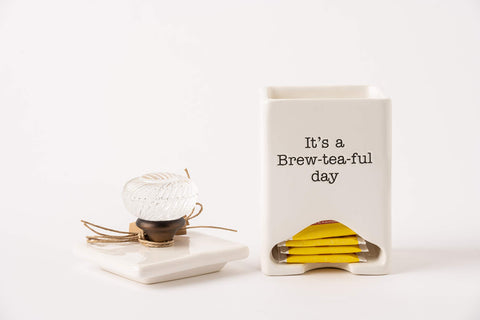 Mud Pie caddy blends function with charm in any tea corner.