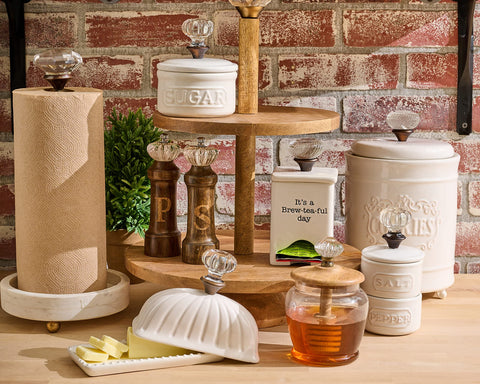Mud Pie ceramic caddy measures 7 by 3.5 inches for compact storage.