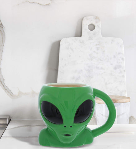 MUGNIV Alien Mug desk companion for note-taking and drinks.