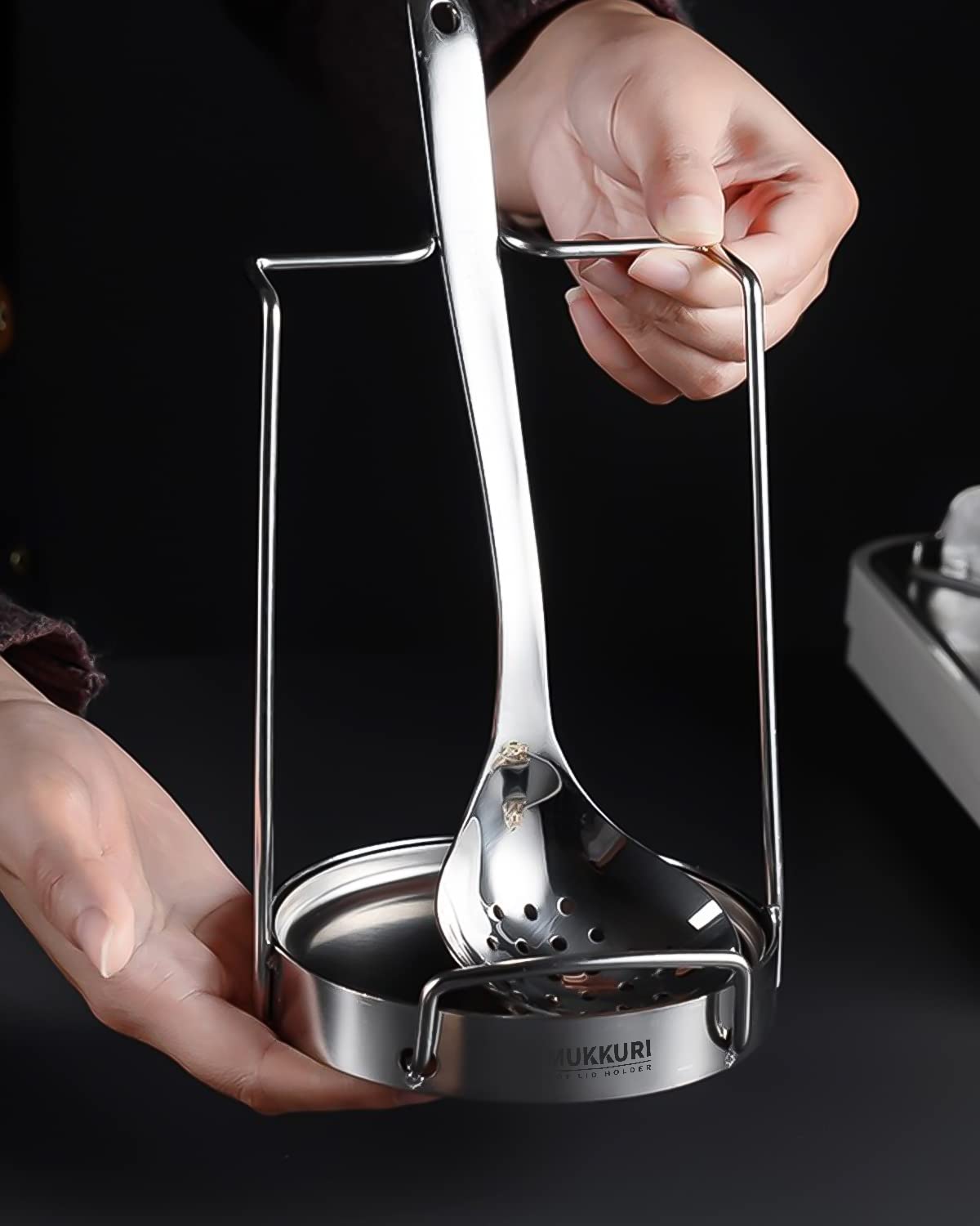 Mukkuri versatile organizer holds lids, spoons, and spatulas neatly.