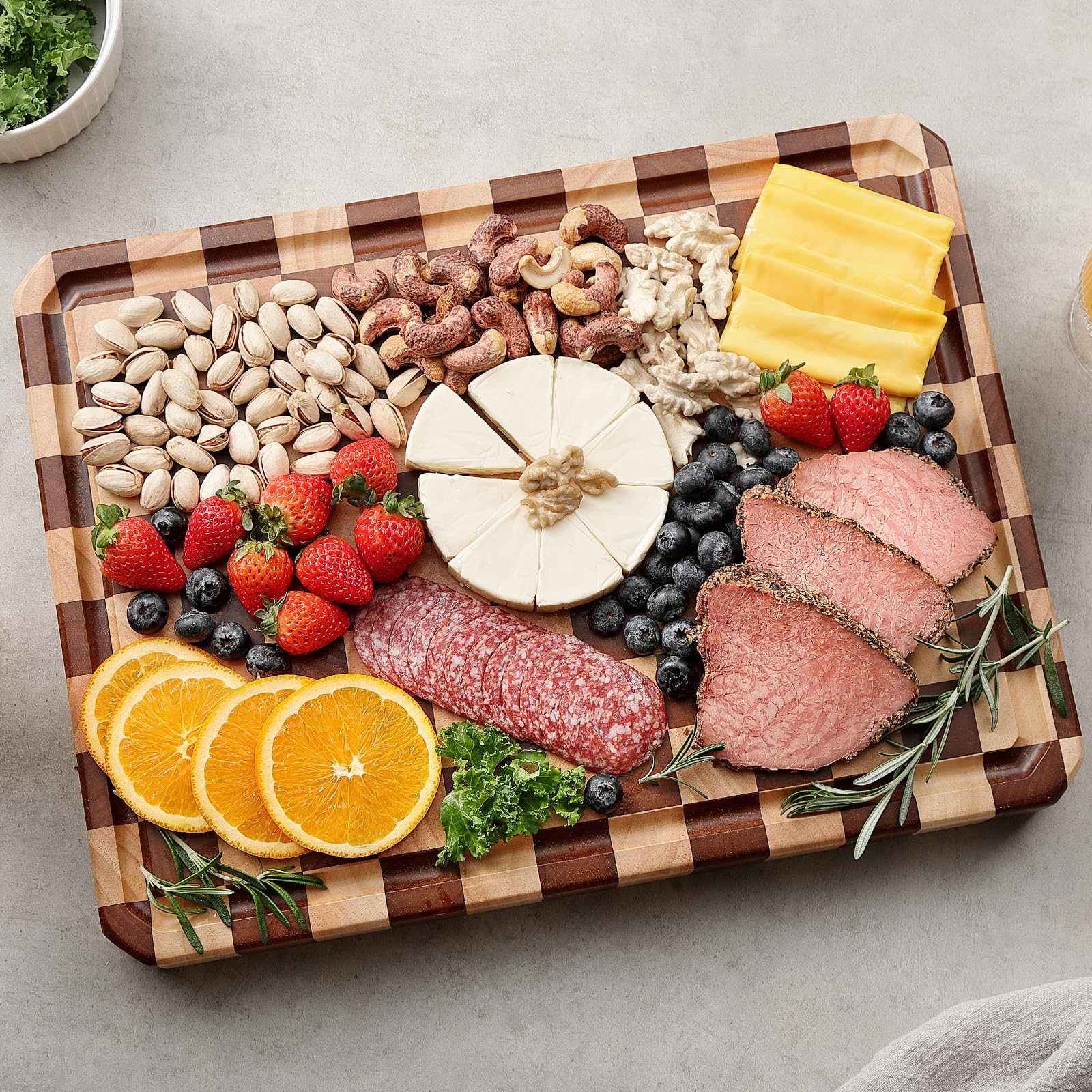 Musifan Acacia cutting board with juice trough to minimize spills.