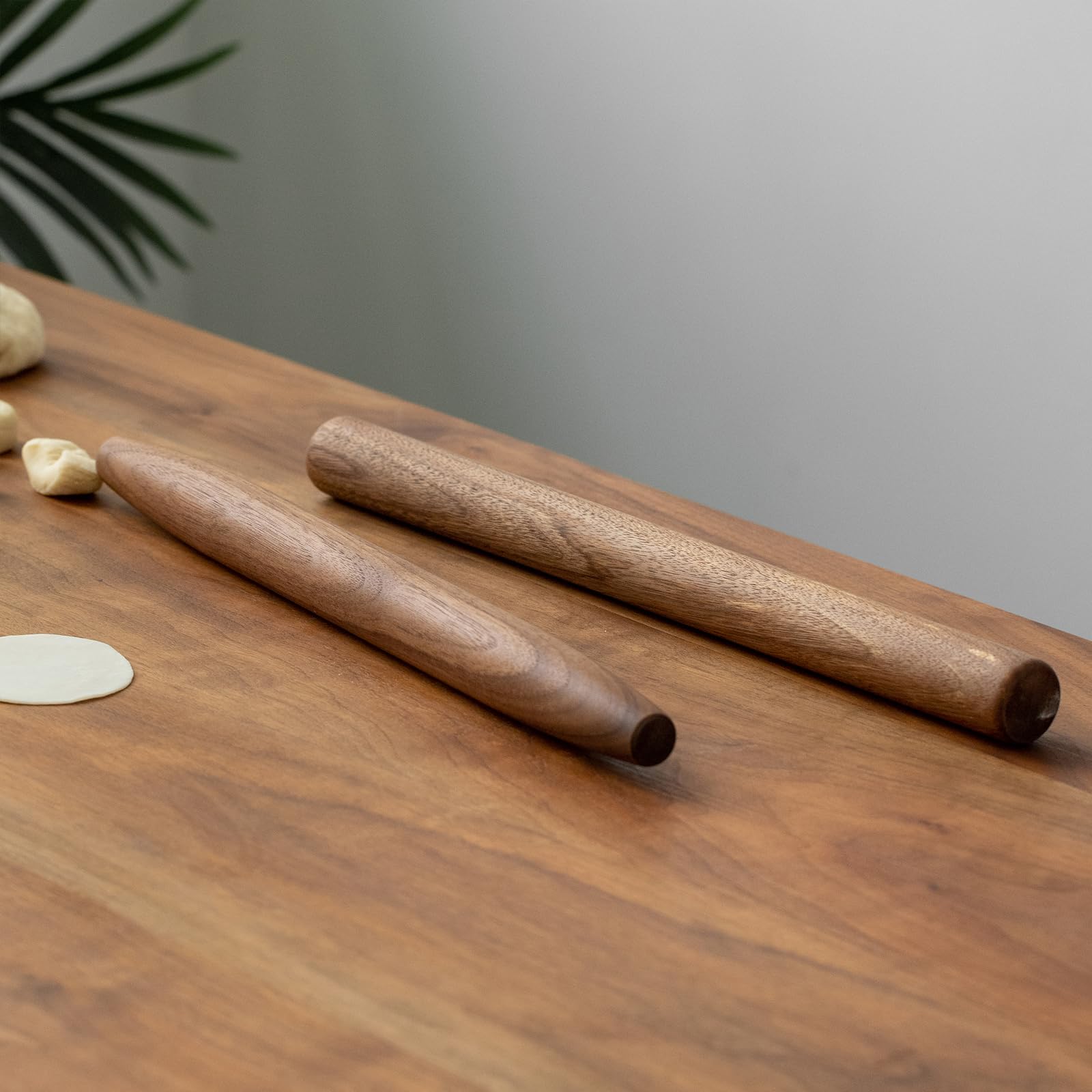 Muso Wood walnut rolling pin resting on kitchen counter, decorative display
