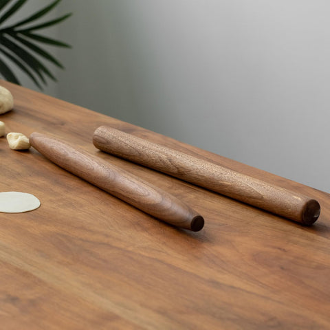 Muso Wood walnut rolling pin resting on kitchen counter, decorative display