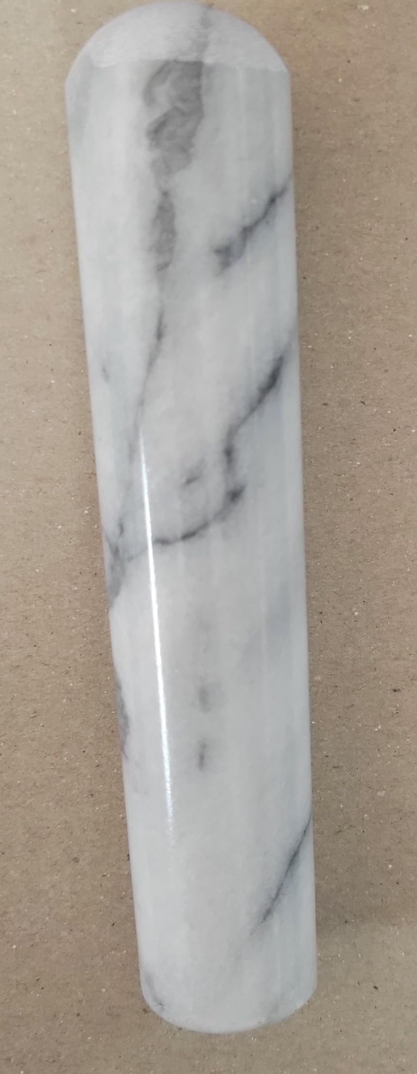 MV Trading MTP5RS marble pestle in use for grinding herbs.