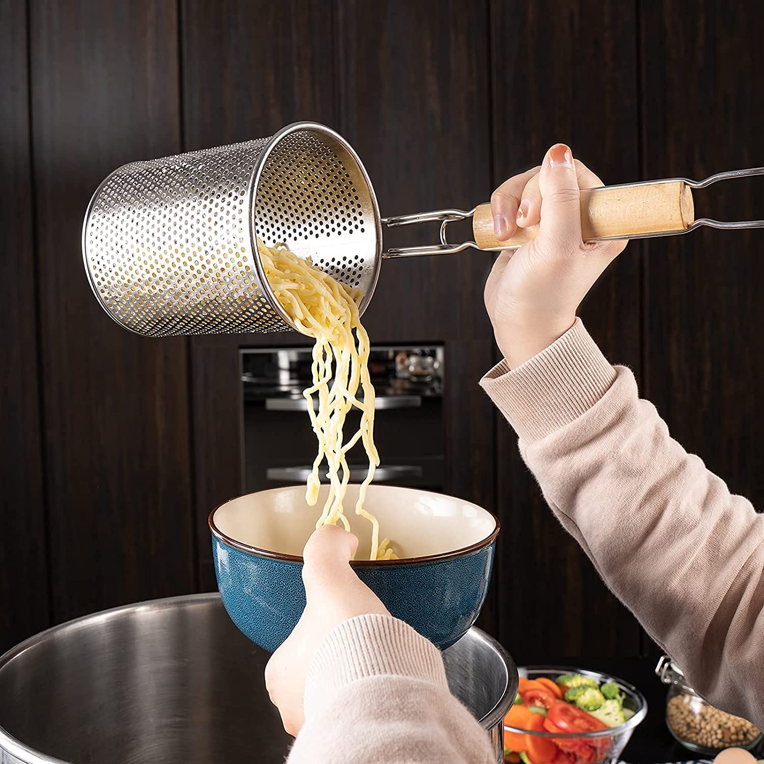 MyLifeUNIT deep basket spider strainer accommodates noodles, dumplings, and vegetables safely.