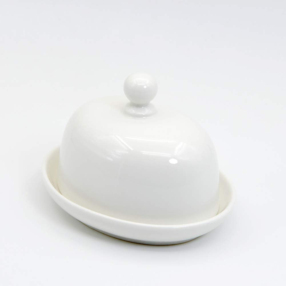 NAGU butter dish on a kitchen counter demonstrates modern, elegant dining accessory.