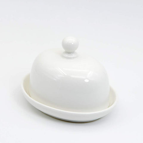 NAGU butter dish on a kitchen counter demonstrates modern, elegant dining accessory.