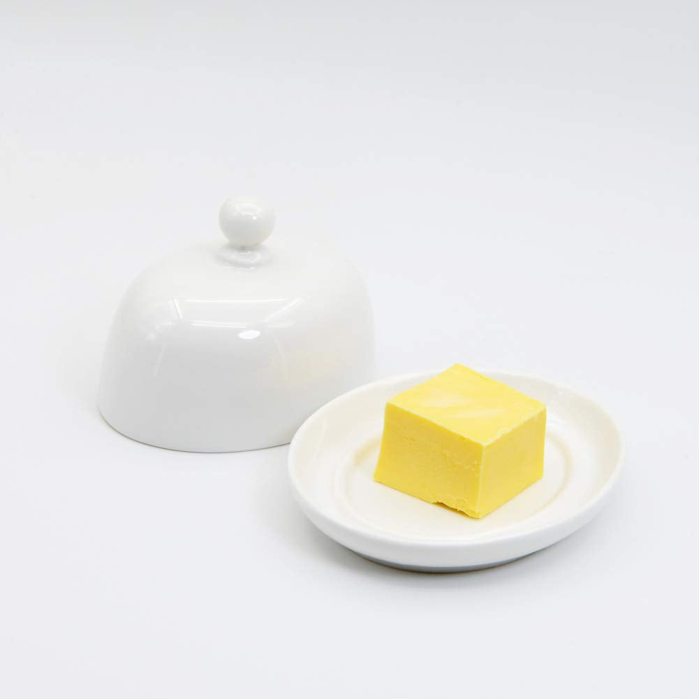 NAGU white porcelain butter dish close-up highlights smooth glaze and durable construction.