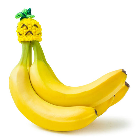 NANA HATS Banana Freshness Preserver on countertop extends banana freshness.