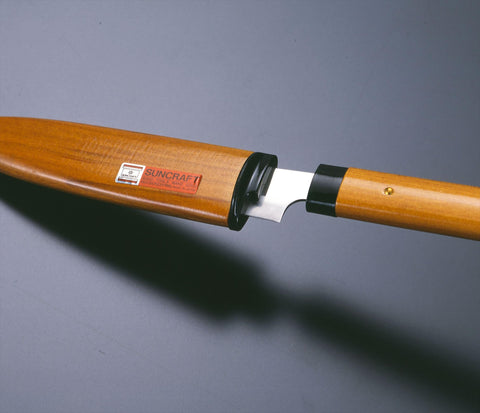 Ergonomic wooden handle provides comfortable grip during prep.