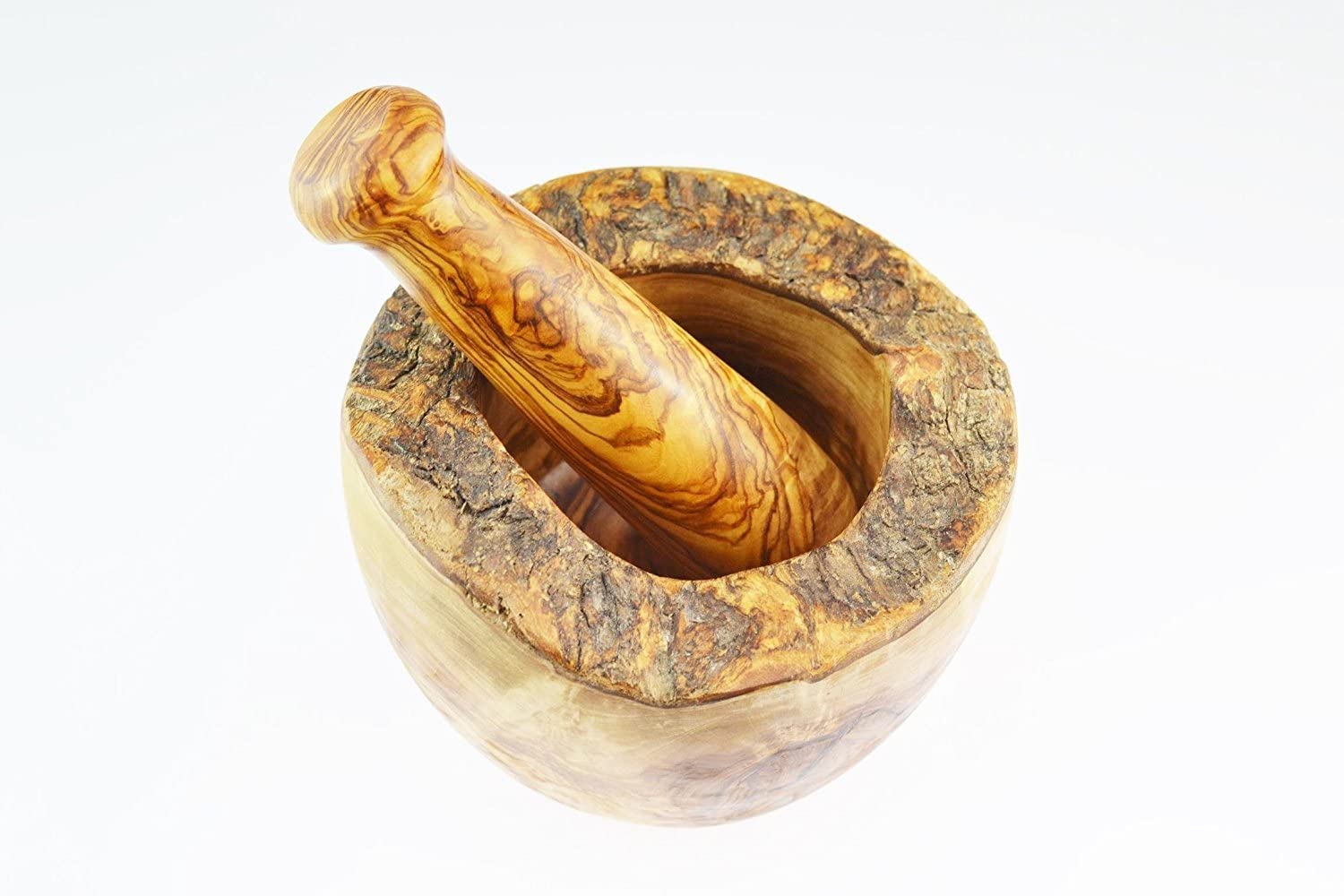 Naturally Med olive wood mortar and pestle in use grinding spices