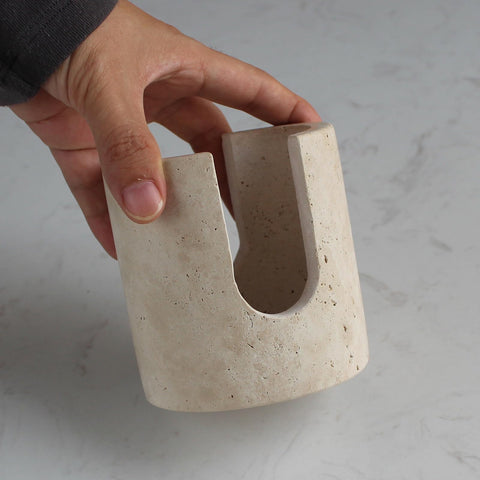 Nawgnail drying rack travertine closeup highlighting quick drying and natural material.