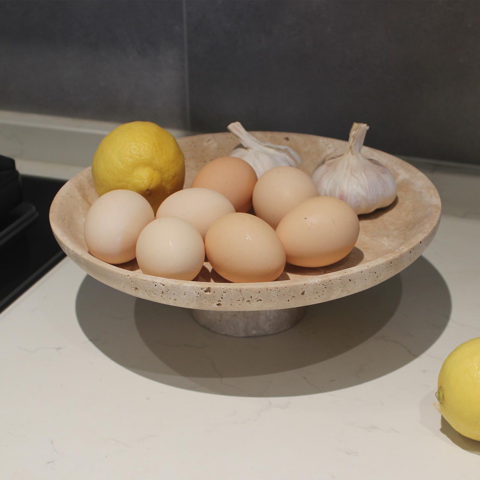 Nawgnail travertine fruit bowl close-up texture highlights natural beige tones