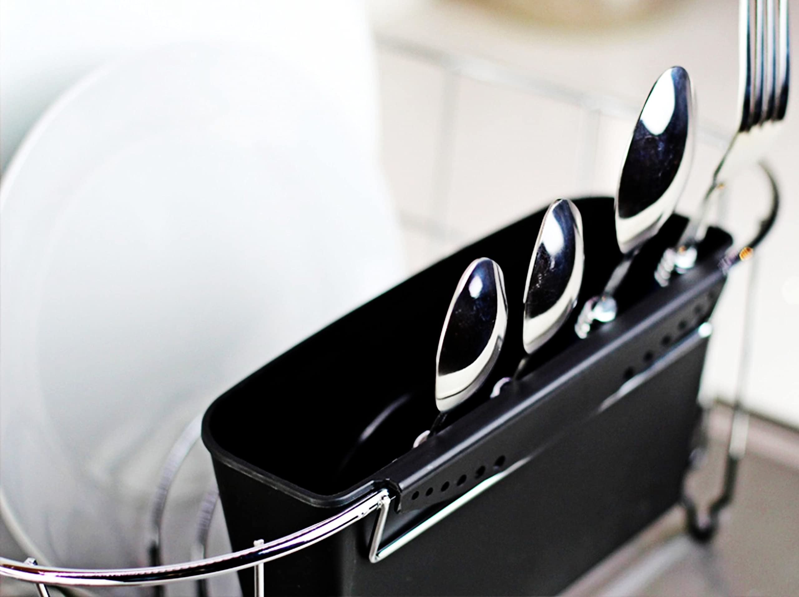 Chrome-plated steel with color-coated base on the Neat-O dish drainer in black.