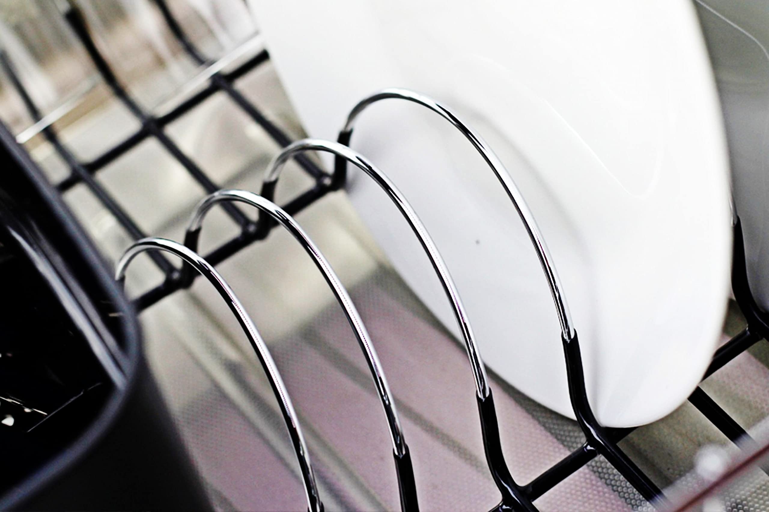 Detachable plastic cutlery cup on the Neat-O drainer for utensils organization.