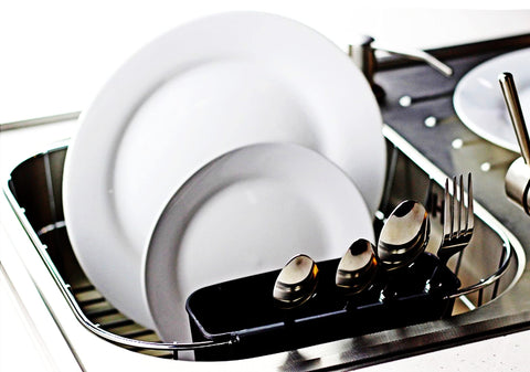 Compact Neat-O chrome dish drainer in black from the side, saving counter space.