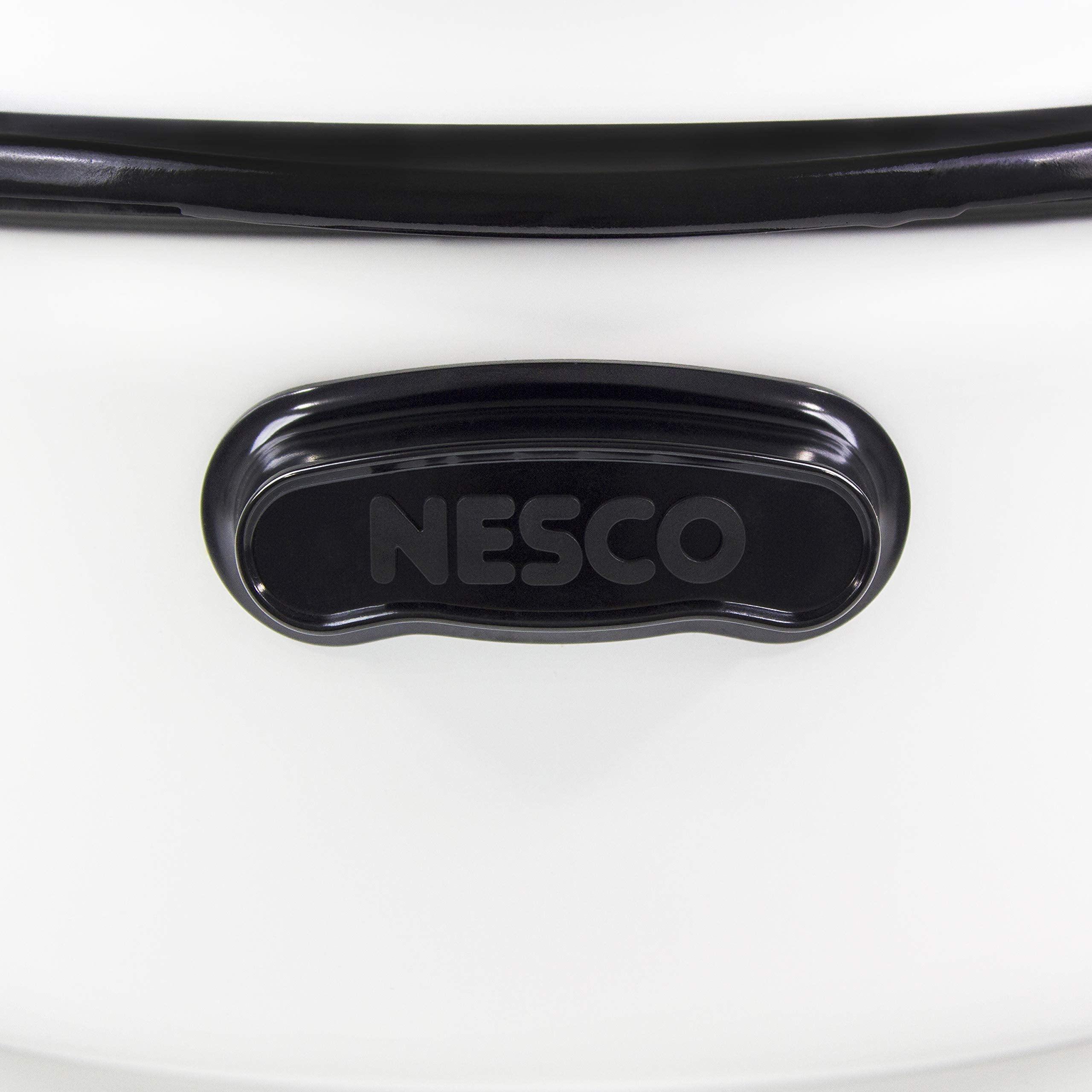Cool-touch handles on the Nesco roaster for safe lifting of hot dishes