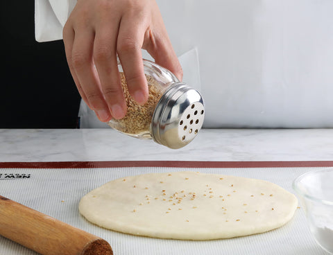 New Star Foodservice 6oz shaker ideal for cheese, pepper, and other toppings at tables.