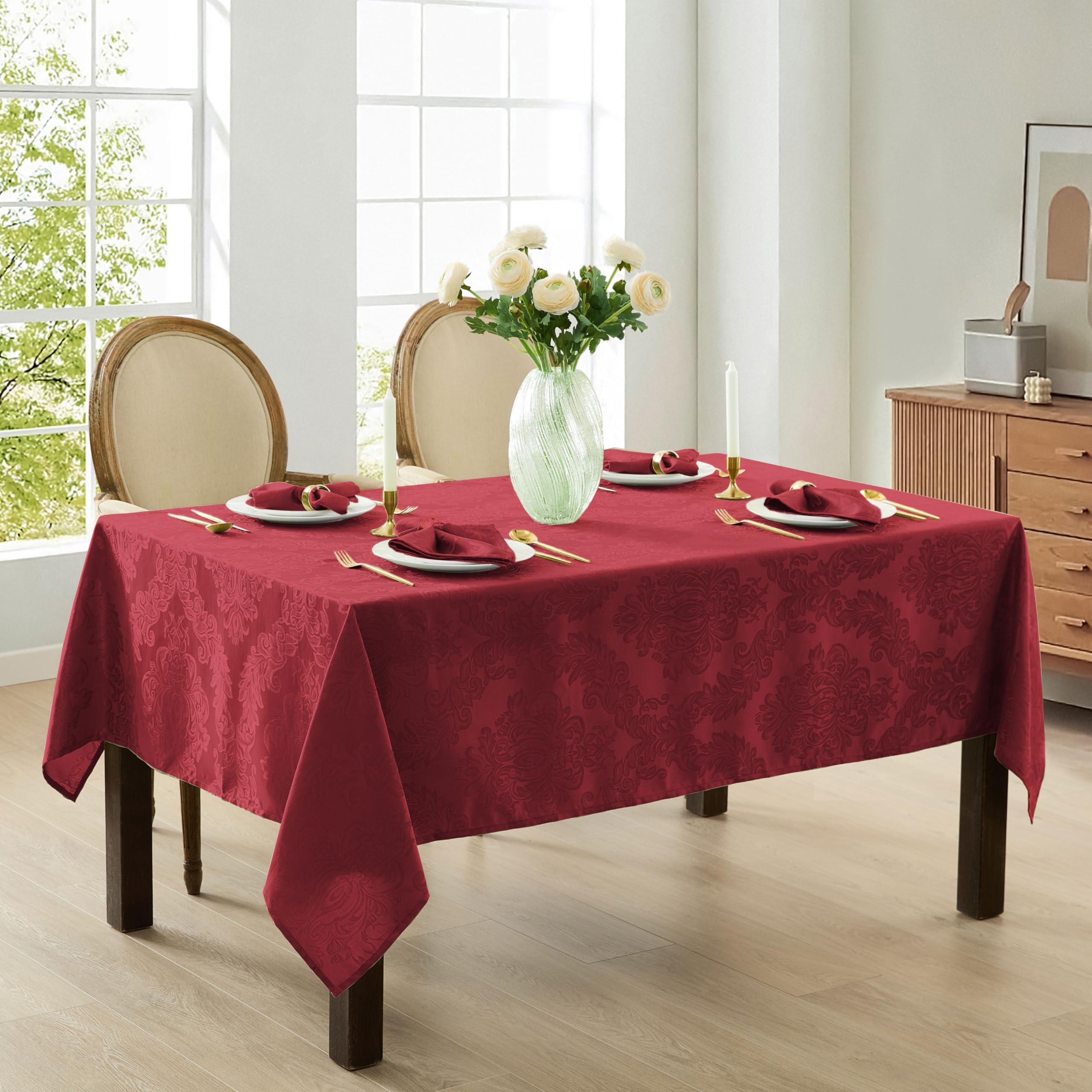 Newbridge Barcelona Damask Tablecloth burgundy spread on table for upscale dining.