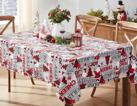 Newbridge Christmas Joy tablecloth on table with Santa print; protects surfaces during holiday meals.