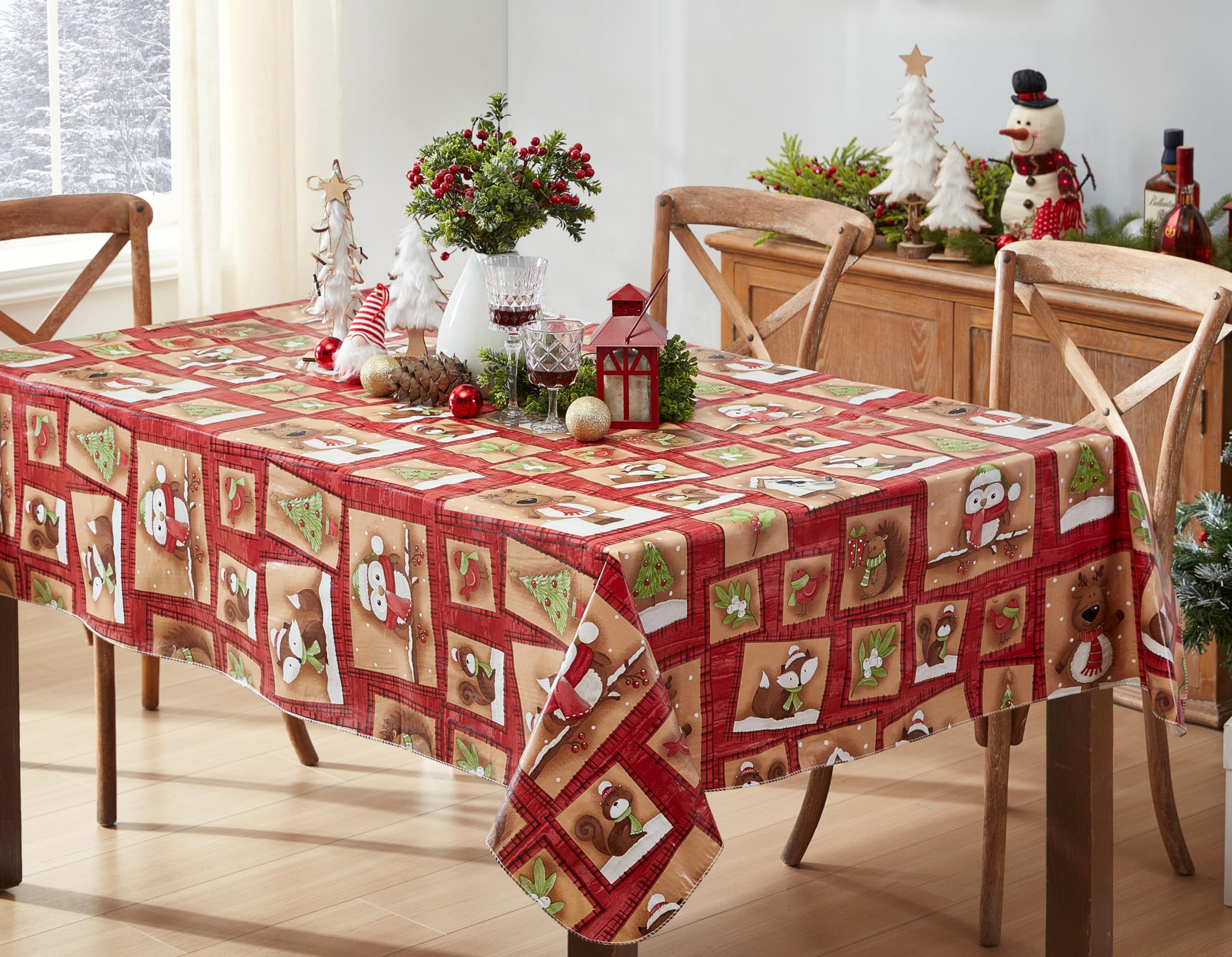 Newbridge Holiday Forest Friends tablecloth with woodland animals adds festive dining charm.
