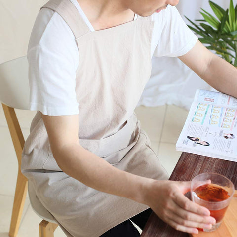 NEWGEM khaki apron featuring no-ties cross-back design for ease.