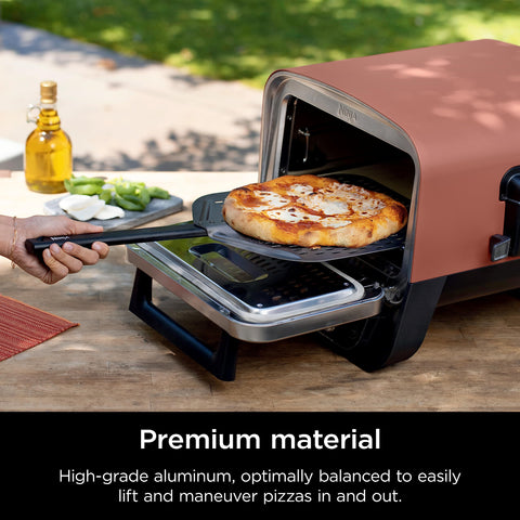 Ninja Woodfire perforated pizza peel aluminum base resists rust for outdoor use.